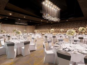 a banquet hall with white tables and white chairs at Sofitel Dubai The Obelisk in Dubai +283 photos