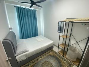 Postel nebo postele na pokoji v ubytování SKY MiMPi Kuala Terengganu Home + 26 fotografií