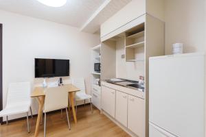 Kuchyň nebo kuchyňský kout v ubytování Nihonbashi Minshuku 智の居