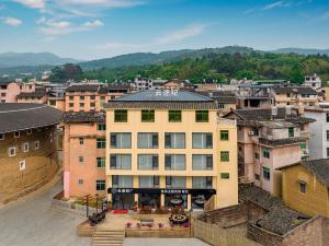 an overhead view of a building in a city at Yuntuji Homestay, Yongding Tulou Branch, Longyan in Bajia