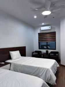 Ένα ή περισσότερα κρεβάτια σε δωμάτιο στο Hoàng Anh Hotel