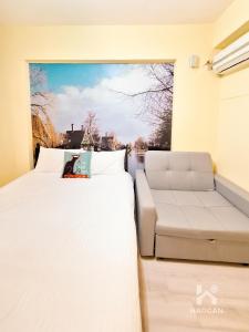 Postel nebo postele na pokoji v ubytování 芳心蘭厝民宿