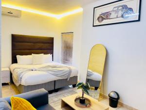 a bedroom with a bed and a car on the wall at Genza Guesthouse in Pretoria in Pretoria