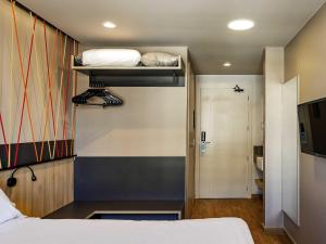 Postel nebo postele na pokoji v ubytování ibis Styles Porto Alegre Moinhos de Vento