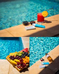 a picture of a tray of fruit and a drink next to a pool at Darunique Inn in Nizwa