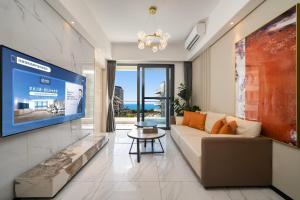 Μια τηλεόραση ή/και κέντρο ψυχαγωγίας στο 来咖海景民宿酒店三亚湾海上大都会右岸店