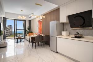 Μια τηλεόραση ή/και κέντρο ψυχαγωγίας στο 来咖海景民宿酒店三亚湾海上大都会右岸店