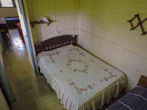 Ένα ή περισσότερα κρεβάτια σε δωμάτιο στο Pousada Sítio Paremi