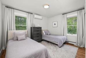 Ένα ή περισσότερα κρεβάτια σε δωμάτιο στο The Homestead at Carter Bridge Estate +32 φωτογραφίες