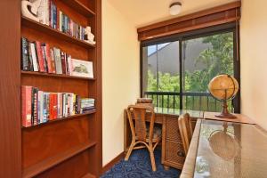 a room with a window and a desk and a chair at Kaanapali Royal D302 · KRL D302 Updated Kaanapali 2BD on Golf Co in Lahaina