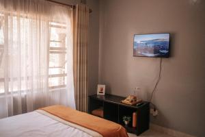 TV a/nebo společenská místnost v ubytování Nate's Nest by The Pause