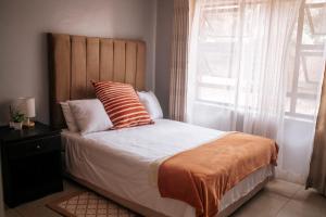 Postel nebo postele na pokoji v ubytování Nate's Nest by The Pause