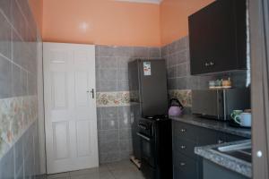 Kuchyň nebo kuchyňský kout v ubytování Nate's Nest by The Pause