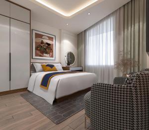 une chambre avec un lit, un canapé et une chaise dans l'établissement Anna Noi Bai Airport Hotel, à Sóc Sơn