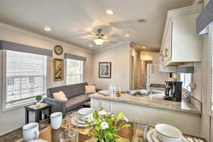 a kitchen and living room with a couch and a table at Dosanko Cottage & Fjord Suite at Equestrian House PA in Pleasant Mount