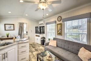 a living room with a couch and a kitchen at Clydesdale Cottage & Brandenburger Suite at Equestrian House PA in Pleasant Mount