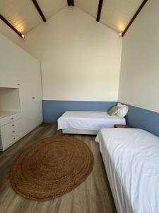 En eller flere senge i et værelse på Appartement Cocoon à Pereybere