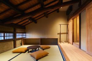 a room with two pillows and a table in it at 宿 -Shuku- in Inuyama