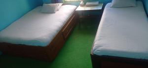 Postel nebo postele na pokoji v ubytování Shubh laxmi hotel Itahari