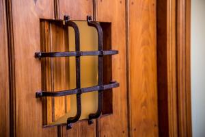 
the door of a wooden door is open at Hotel Boutique Posada Dos Orillas in Trujillo
