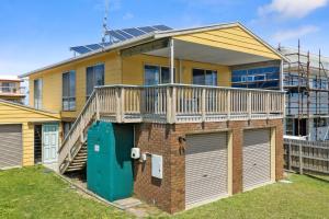 a house with solar panels on top of it at Neptune's Nook in Cape Paterson