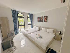 Ένα ή περισσότερα κρεβάτια σε δωμάτιο στο La Maison De Dino Grandworld