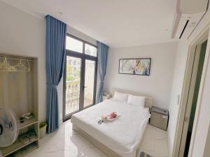 Ένα ή περισσότερα κρεβάτια σε δωμάτιο στο La Maison De Dino Grandworld