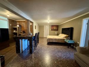 Postel nebo postele na pokoji v ubytování SUITE 4, Centro de Cuauhtemoc Chihuahua