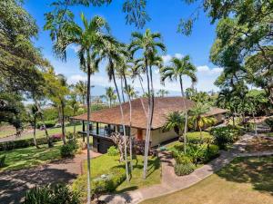an aerial view of a house with palm trees at Hale Kalapu · Large Home 180° Ocean Views Walk2Beach Hale Kalapu in Kaanapali