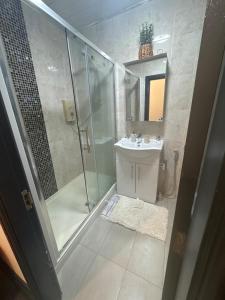 a bathroom with a shower and a sink at Huddersfield City Center Retreat - New Images coming soon in Huddersfield