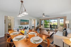 a dining room and living room with a table and chairs at Kaanapali Plantation 34 · KPL 34 2BD Pool & Resort's Amenities, in Kahana