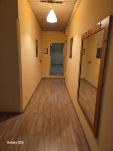 an empty hallway in an office building with a mirror at Giappone Inn Flat in Livorno