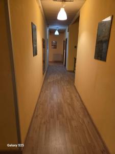 an empty hallway in an office building with wood floors at Giappone Inn Flat in Livorno +19 photos