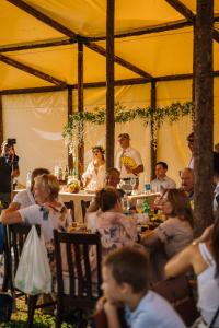 a group of people sitting at a table in a tent at Гора Глэмпинг in Besqaynar +123 photos