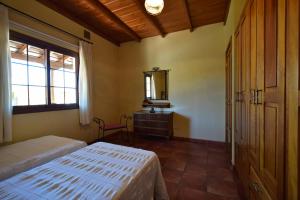 Postel nebo postele na pokoji v ubytování Casas Rurales Tola