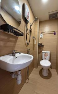 a bathroom with a sink and a toilet at Jade Guesthouse Jonker Street Melaka in Malacca +151 photos