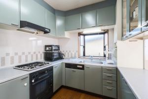 Kuchyň nebo kuchyňský kout v ubytování Snow base Iiyama