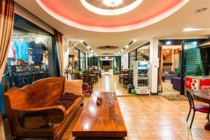 a room with a couch and a table in a store at Huen Fai Mae-Jampee in Ban Thung Laeng