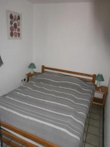 מיטה או מיטות בחדר ב-Le Hameau de Talaris