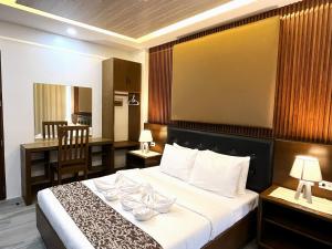 Postel nebo postele na pokoji v ubytování LDR Travellers Inn + 50 fotografií