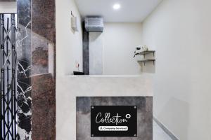 a lobby with a counter with a sign on it at Collection O Kachiguda Bus Terminal Hyderabad in Hyderabad