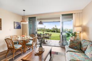 a living room with a couch and a table at Eldorado A108 in Kaanapali