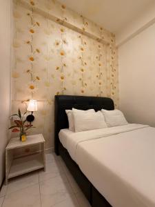 Postel nebo postele na pokoji v ubytování Jade Guesthouse Jonker Melaka