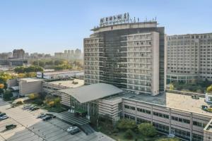 an aerial view of a large building in a city at Jinjiang Hotel Qianan in Qian'an