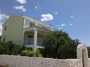 a large white house with a white fence at Apartment Peris in Sevid
