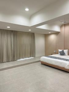 Ένα ή περισσότερα κρεβάτια σε δωμάτιο στο Hotel Sun Shine