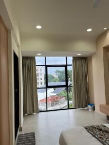 Ένα ή περισσότερα κρεβάτια σε δωμάτιο στο Hotel Sun Shine