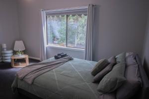 Ένα ή περισσότερα κρεβάτια σε δωμάτιο στο A Touch Of Sage On York