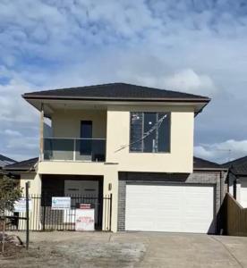 a large white house with a white garage at 1 Private room available in Wollert in Wollert