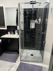 a bathroom with a shower and a sink at 1 Private room available in Wollert in Wollert
